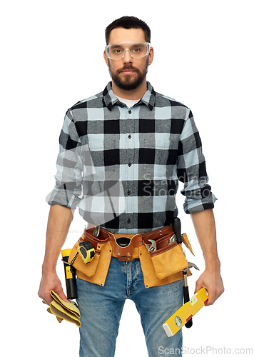 Image of male worker or builder with tools and level