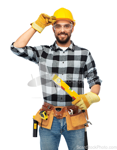 Image of happy male worker or builder in helmet with level