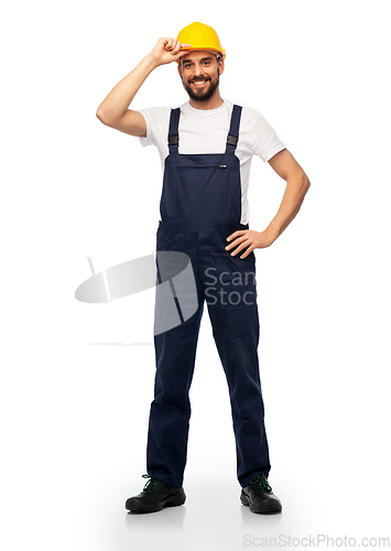 Image of happy smiling male worker or builder in helmet