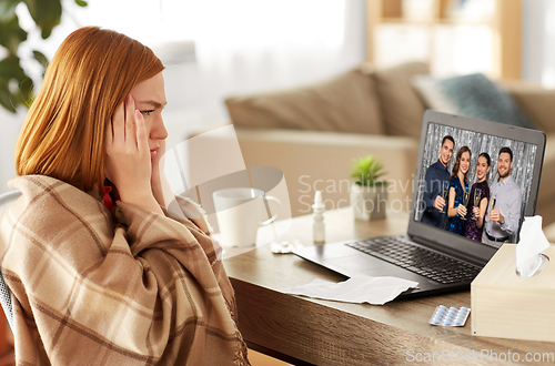 Image of sick woman having video call with friends at home