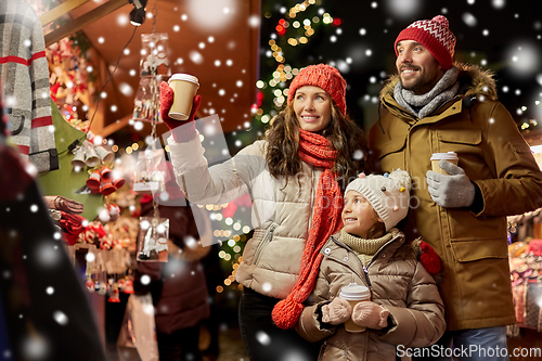 Image of family with takeaway drinks at christmas market