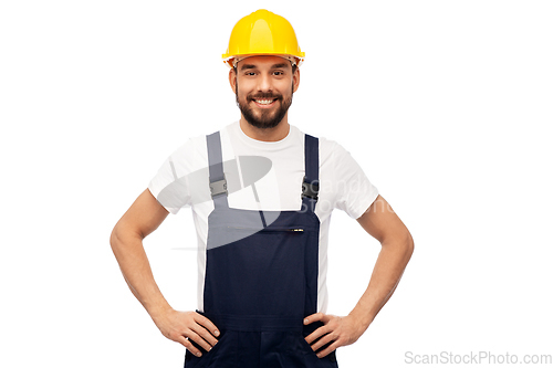 Image of happy smiling male worker or builder in helmet