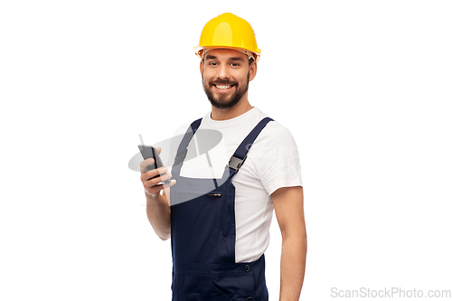 Image of happy male worker or builder with smartphone