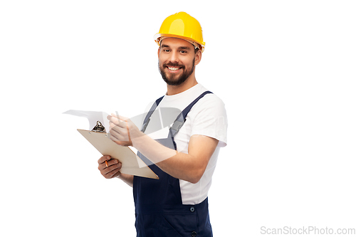 Image of male worker or builder in helmet with clipboard