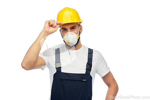 Image of male worker or builder in helmet and respirator