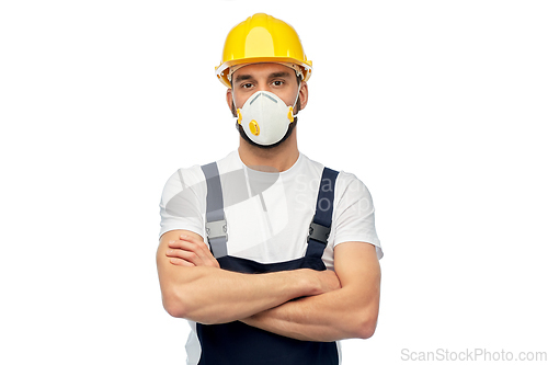 Image of male worker or builder in helmet and respirator