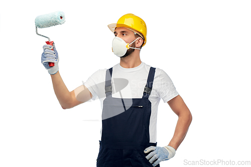 Image of worker or builder in respirator with paint roller