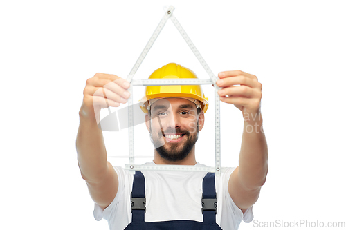 Image of happy male worker or builder with carpenter's rule