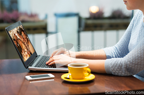 Image of close up of woman having video call on laptop