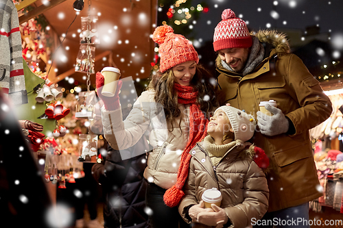 Image of family with takeaway drinks at christmas market