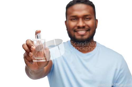 Image of happy african american man with perfume