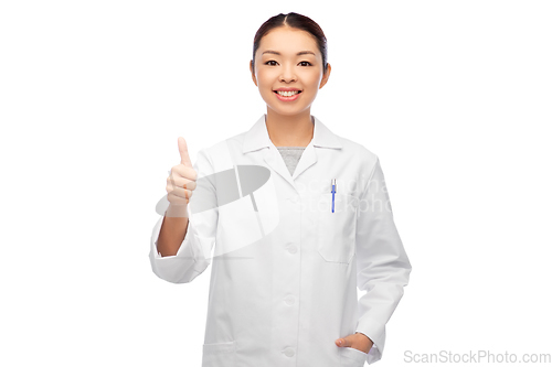 Image of smiling asian female doctor showing thumbs up