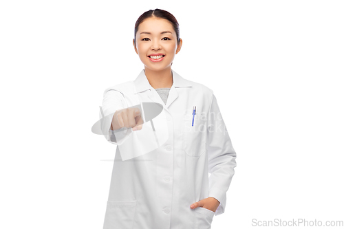 Image of happy asian female doctor pointing to camera