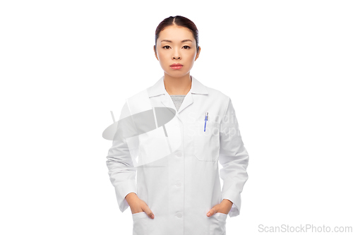 Image of asian female doctor in white coat