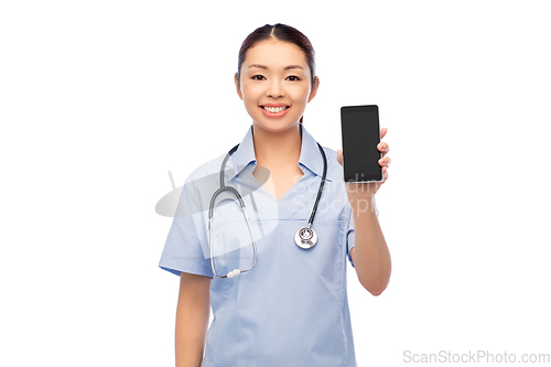 Image of happy asian female doctor or nurse with smartphone