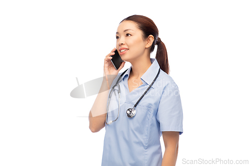 Image of asian female doctor or nurse calling on smartphone