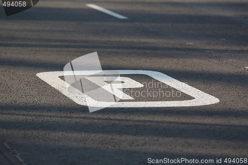 Image of Parking sign painted on the road