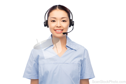 Image of smiling asian female doctor or nurse in headset