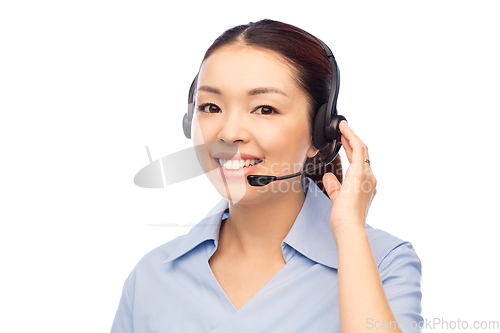 Image of smiling asian female doctor or nurse in headset