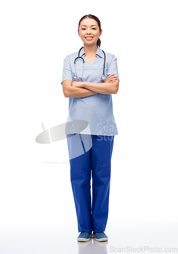 Image of smiling asian female doctor or nurse in uniform