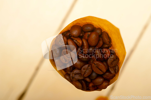 Image of espresso coffee beans on a paper cone