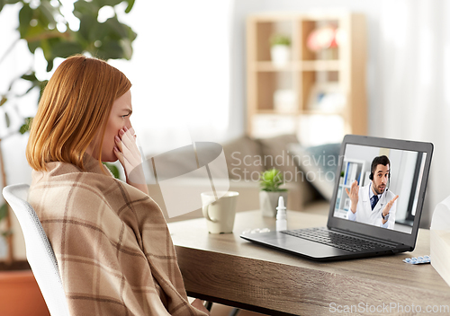 Image of sick woman having video call with doctor on laptop