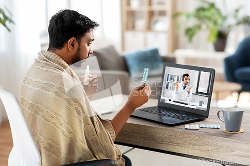 Image of sick man having video call with doctor on laptop