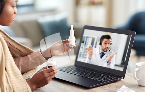 Image of sick woman having video call with doctor on laptop