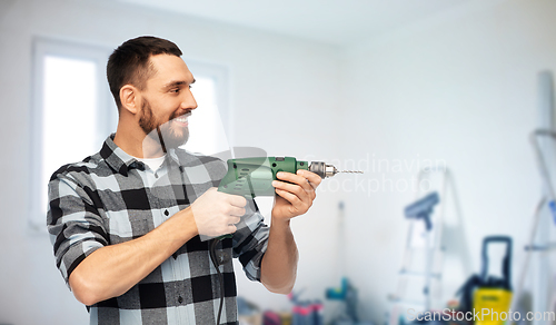 Image of happy man, worker or builder with drill