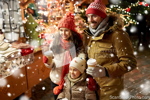 Image of family with takeaway drinks at christmas market