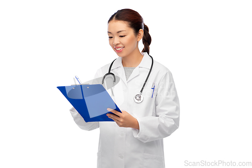 Image of happy smiling asian female doctor with clipboard