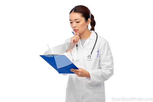 Image of asian female doctor with clipboard