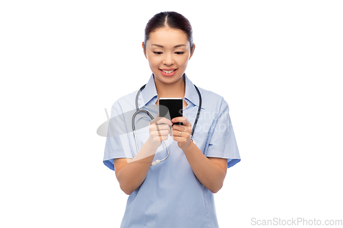 Image of happy asian female doctor or nurse with smartphone