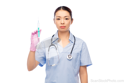 Image of asian female nurse with medicine and syringe