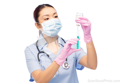 Image of asian nurse in mask with medicine in syringe