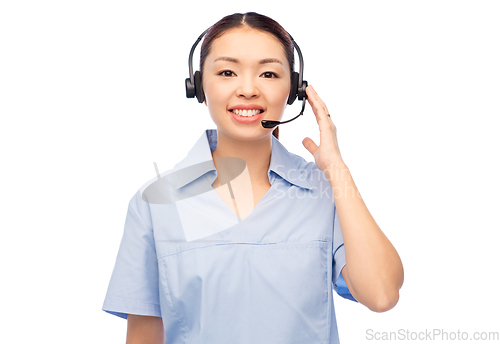 Image of smiling asian female doctor or nurse in headset