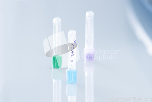 Image of Covid-19 vaccination tubes on a clinical desk