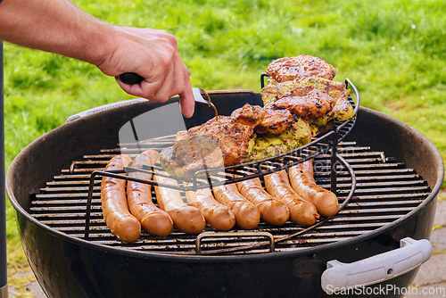 Image of Barbeque grill party with pork chops