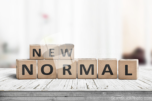 Image of New normal lifestyle sign on a white table