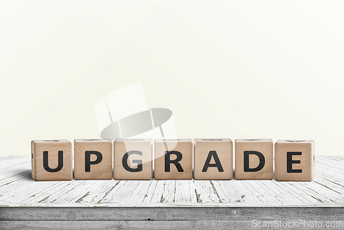 Image of Upgrade sign made with wooden blocks