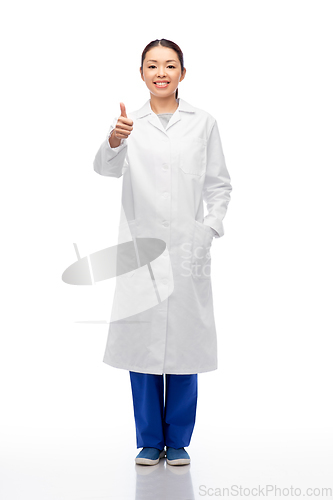 Image of smiling asian female doctor showing thumbs up