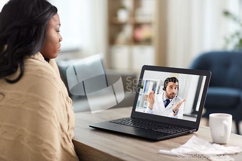 Image of sick woman having video call with doctor on laptop