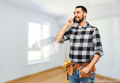 Image of builder in helmet calling on smartphone