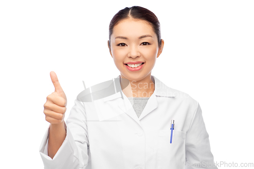 Image of smiling asian female doctor showing thumbs up