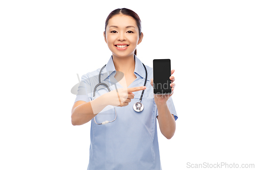 Image of happy asian female doctor or nurse with smartphone