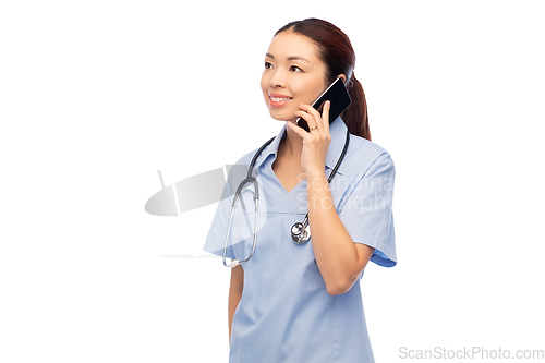 Image of asian female doctor or nurse calling on smartphone