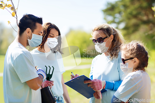 Image of group of volunteers planting trees in park