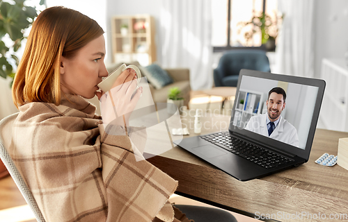 Image of sick woman having video call with doctor at home