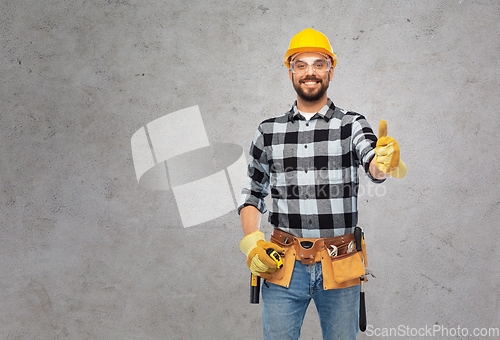 Image of happy male worker or builder showing thumbs up