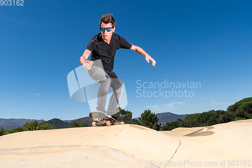 Image of Skateboarder on a pump track park